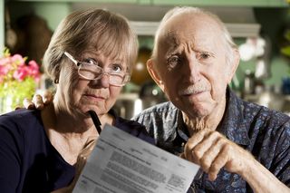 Older couple with document