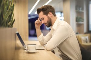 Man thinking on computer