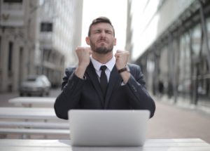 Happy man on computer